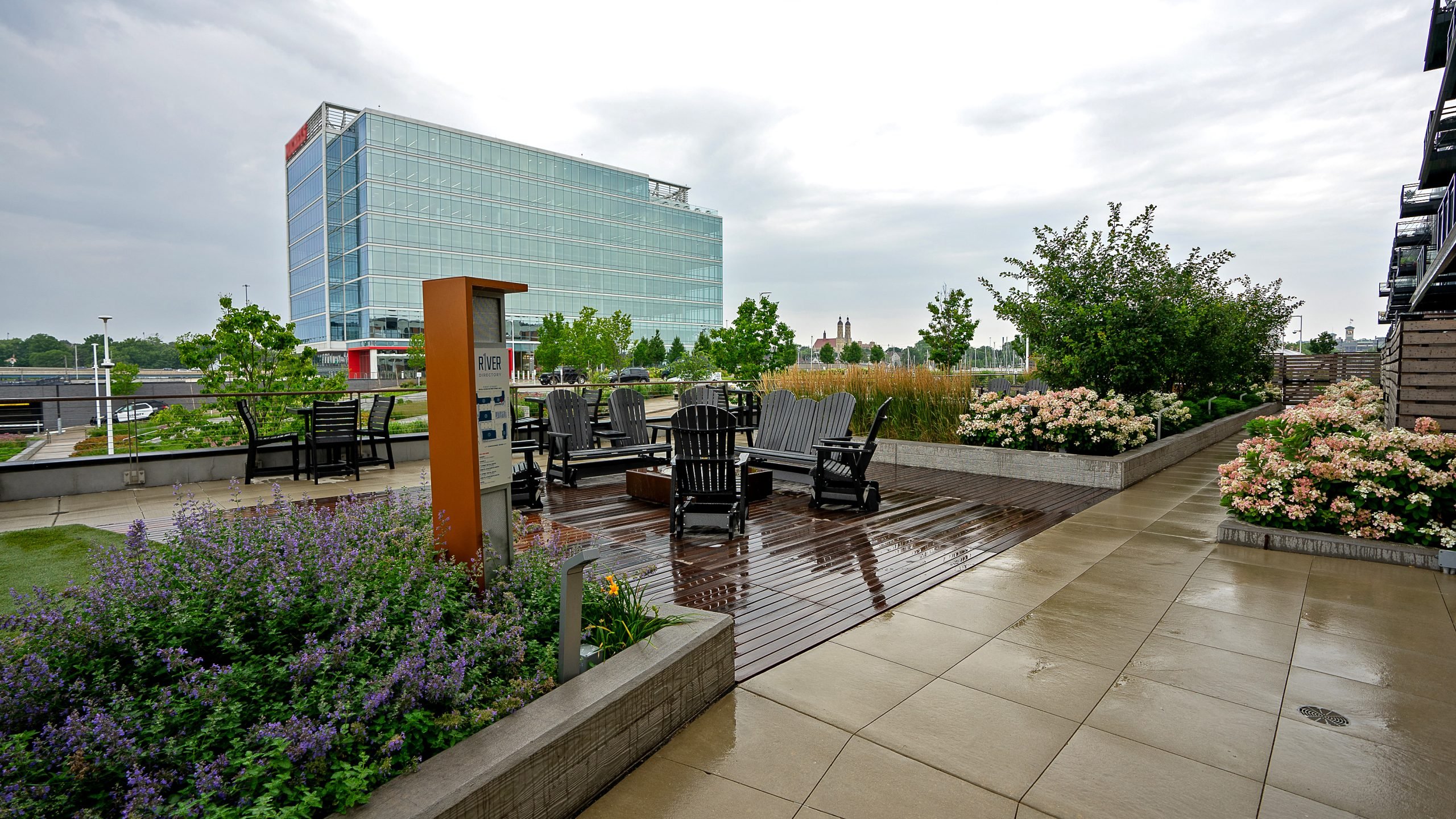 Social space on amenity deck with hydrangeas and grasses creating vibrant textures